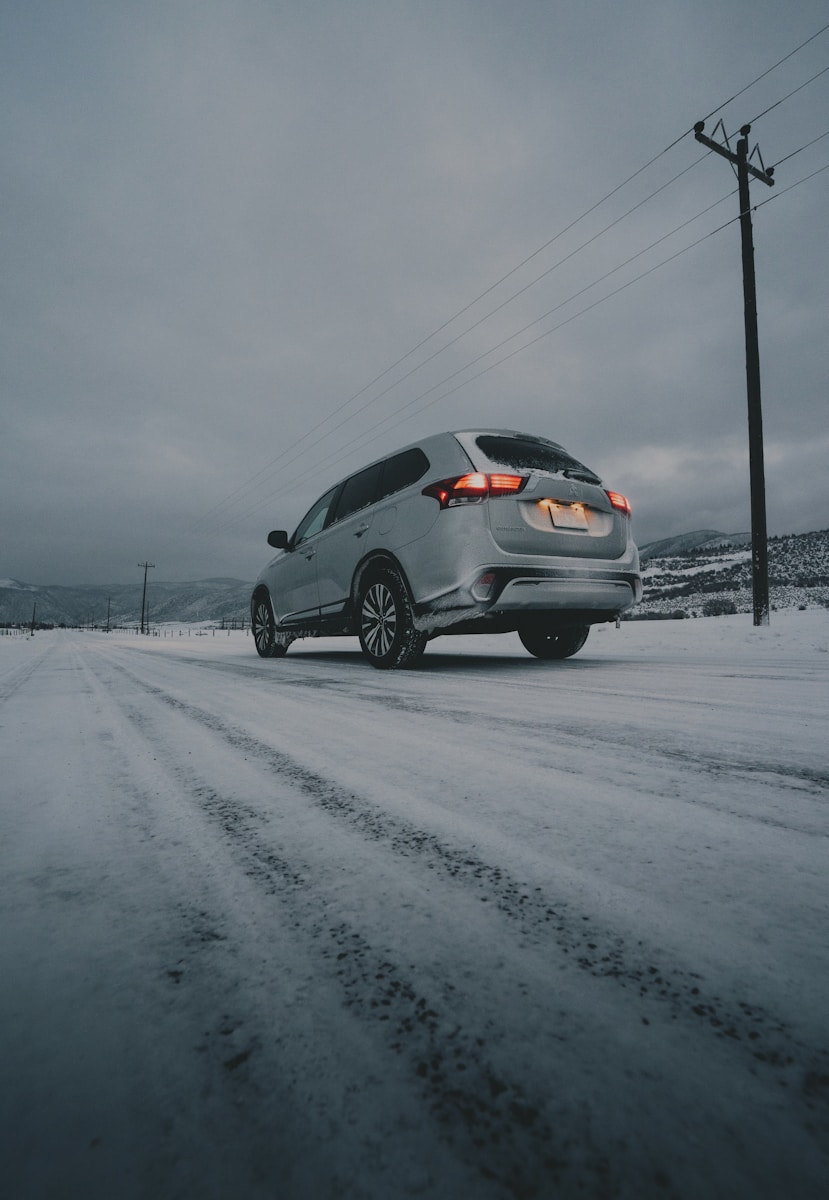 gray vehicle on snow field